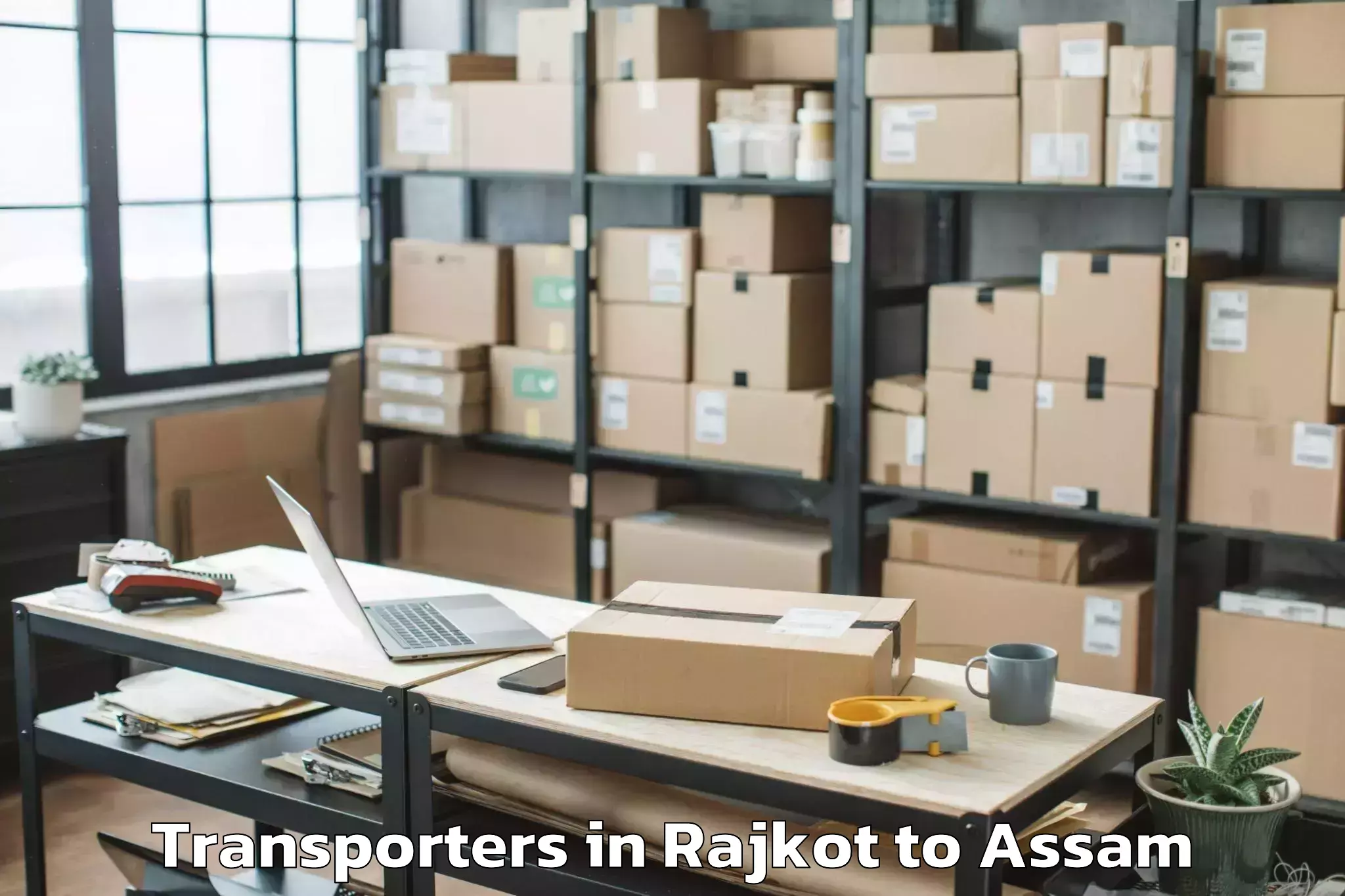 Book Rajkot to Rangia Transporters Online